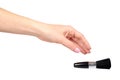 Hand with black eye makeup brush. Isolated Royalty Free Stock Photo