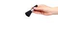 Hand with black eye makeup brush. Isolated Royalty Free Stock Photo