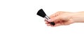 Hand with black eye makeup brush. Isolated