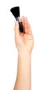 Hand with black eye makeup brush. Isolated Royalty Free Stock Photo