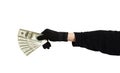 Hand in black glove holding money Royalty Free Stock Photo