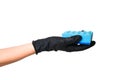 Hand in black glove holds a sponge for washing dishes Royalty Free Stock Photo