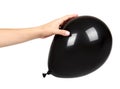 Hand with black inflateble balloon, party event decoration, glossy ball Royalty Free Stock Photo