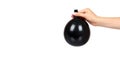 Hand with black inflateble balloon, party event decoration, glossy ball Royalty Free Stock Photo