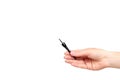 Hand with black liquid pencil, eye makeup brush Royalty Free Stock Photo