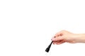 Hand with black liquid pencil, eye makeup brush Royalty Free Stock Photo