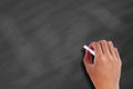 Hand on a blank chalkboard Royalty Free Stock Photo