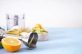 Hand blender and accessories with sliced fruit on a wooden background, place for text, close up Royalty Free Stock Photo