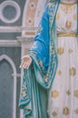 Hand of The Blessed Virgin Mary statue standing in front of The Roman Catholic Diocese that is public place.