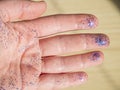 Hand with blue glittering brocade close up. Working crafts.