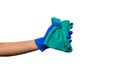 Hand in a blue glove with green rag Royalty Free Stock Photo