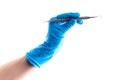 Hand in blue glove holding dental metal stick isolated Royalty Free Stock Photo