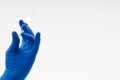 Hand in a blue glove holding syringe Royalty Free Stock Photo