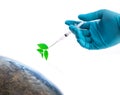 Hand in a blue glove holding syringe, inject plant to the world, safe the world concept, Elements of this image furnished by NASA Royalty Free Stock Photo