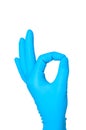 Hand in blue glove OK sign isolated Royalty Free Stock Photo