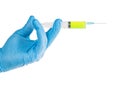 Hand in blue gloves holding syringe with green substance isolated Royalty Free Stock Photo