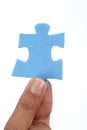 Hand With Blue Jigsaw Puzzle