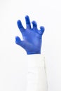 Hand in blue latex Glove grabing. Copy space Royalty Free Stock Photo