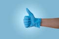 Hand with blue latex glove Royalty Free Stock Photo