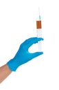 Hand in a blue medical glove holding syringe Royalty Free Stock Photo