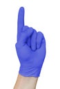 Hand in blue medical glove showing attention sign with forefinger up, isolated on white background Royalty Free Stock Photo