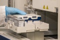 A hand with blue nitril gloves puting a PCR plate into a sanger genetic analyser. Royalty Free Stock Photo