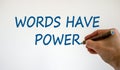 Hand with blue pencil writing `words have power`,  on beautiful white background. Concept. Copy space Royalty Free Stock Photo