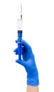 Hand with blue syringe Royalty Free Stock Photo
