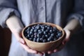 Hand blueberry bowl plate. Generate Ai Royalty Free Stock Photo