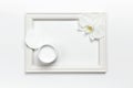 Hand or body cream, orchid flower, cotton pads, Photo frame on light background top view flat lay. Cosmetics SPA branding mock-up