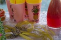 Hand boutonniere with `Brides tribe` and cups with pineapple, tropical party concept, decoration for bachelorette party, hand