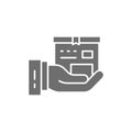 Hand with box, express delivery grey icon.