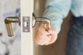 The hand of the boy holding the door handle opening it Royalty Free Stock Photo