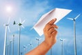 Hand boy play paper plane on wind turbine Royalty Free Stock Photo