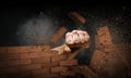 Hand breaking through the wall. Mixed media Royalty Free Stock Photo