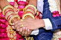 Hand of the bride held by a groom during a traditional ritual in an Indian Hindu Wedding Royalty Free Stock Photo