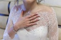 Bride holds her hand with an engagement ring on chest Royalty Free Stock Photo