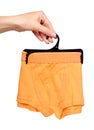 Hand with bright boxer underwear, cotton pants Royalty Free Stock Photo