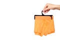 Hand with bright boxer underwear, cotton pants Royalty Free Stock Photo