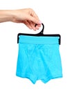 Hand with bright boxer underwear, cotton pants Royalty Free Stock Photo