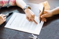 Hand of broker showing to client where to sign signature contract Royalty Free Stock Photo