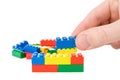 Hand build a color plastic bricks Royalty Free Stock Photo