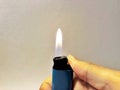 Hand of burning gas lighters, Portable device used to create a flame, Close-up Royalty Free Stock Photo