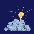 Hand with a burning light bulb is pulled up from a mountain of non-performing / start up creative ideas