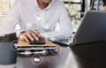 Hand business man doing finances and calculate on desk about cost at office Royalty Free Stock Photo