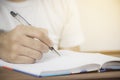 The hand of a business man writing a blank notebook. Royalty Free Stock Photo