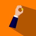 Hand in a business suit holds a gold coin. Investments, saving and protection of money, capital