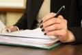 Hand of business woman with document viewer