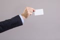 Hand of a businessman with a blank card