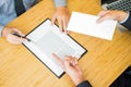 Hand of a businessman hands over a resignation letter final remuneration to executive boss on a wooden table to his boss Change of Royalty Free Stock Photo